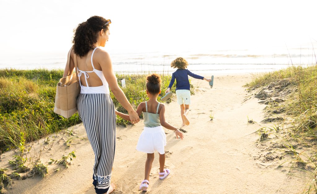 Sanderling Resort guests head to the beach.